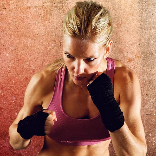 Mixed Martial Arts Lessons for Adults in Alpharetta GA - Lady Kickboxing Focused Background